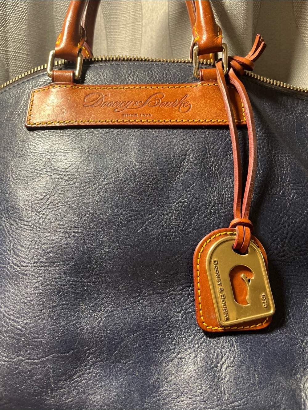 Dooney & Bourke Navy Leather Satchel with Brown Trim and Gold Accent